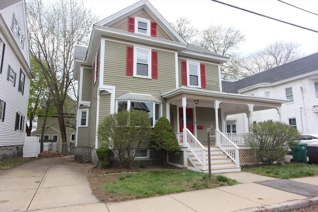 271 Gibson St, Lowell, MA 01851 - view of front facade featuring covered porch and concrete driveway