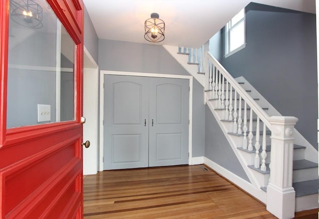 271 Gibson St, Lowell, MA 01851 - entrance foyer featuring stairs, wood finished floors, and baseboards