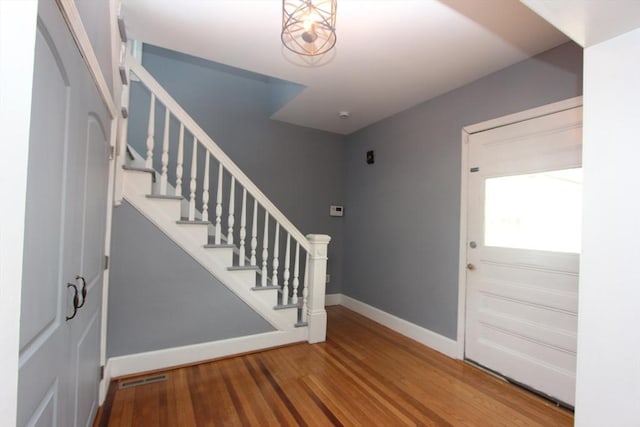 271 Gibson St, Lowell, MA 01851 - foyer featuring stairway, baseboards, and wood finished floors