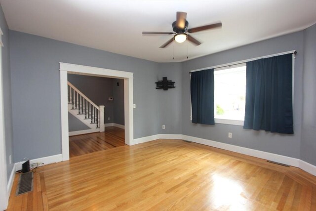 271 Gibson St, Lowell, MA 01851 - unfurnished room featuring stairs, ceiling fan, wood finished floors, and baseboards
