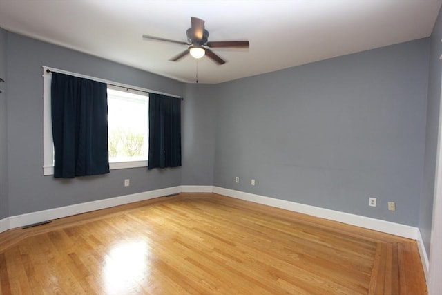 271 Gibson St, Lowell, MA 01851 - empty room with a ceiling fan, light wood-style floors, and baseboards