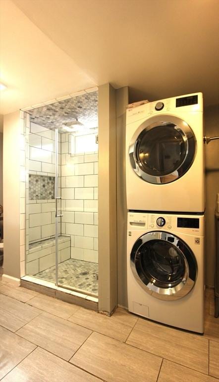 271 Gibson St, Lowell, MA 01851 - clothes washing area featuring stacked washer and clothes dryer
