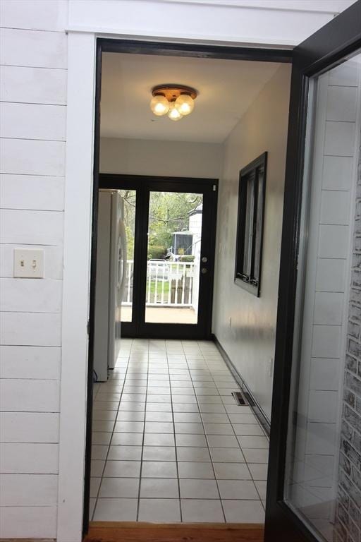 271 Gibson St, Lowell, MA 01851 - doorway with light tile patterned floors