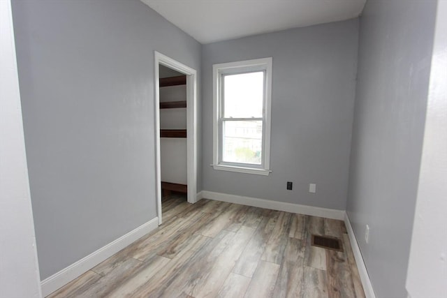 271 Gibson St, Lowell, MA 01851 - unfurnished room featuring light wood-type flooring and baseboards