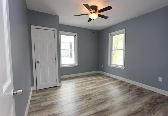 271 Gibson St, Lowell, MA 01851 - spare room with light wood-style floors, a ceiling fan, and baseboards