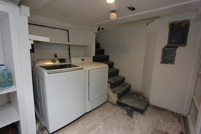 271 Gibson St, Lowell, MA 01851 - laundry room featuring independent washer and dryer, electric panel, and light wood-style floors