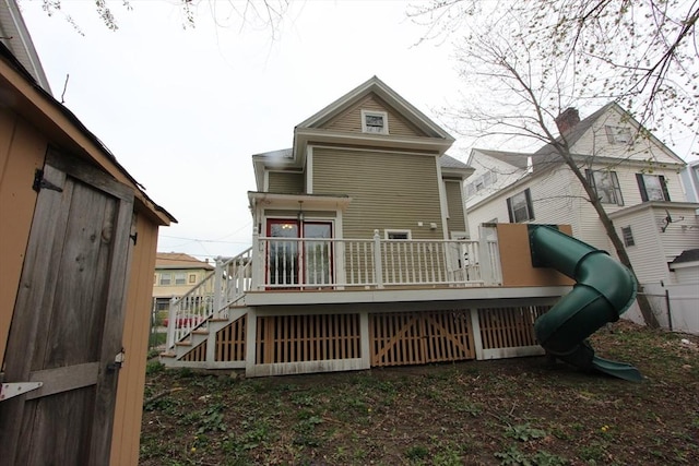 271 Gibson St, Lowell, MA 01851 - rear view of property featuring stairs and a wooden deck
