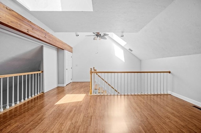 30 Eastern Point Dr Unit 30, Shrewsbury, MA 01545 - additional living space featuring a skylight, wood finished floors, a ceiling fan, baseboards, and lofted ceiling