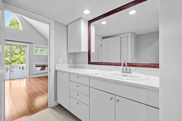 30 Eastern Point Dr Unit 30, Shrewsbury, MA 01545 - bathroom featuring recessed lighting, vanity, lofted ceiling, and baseboards