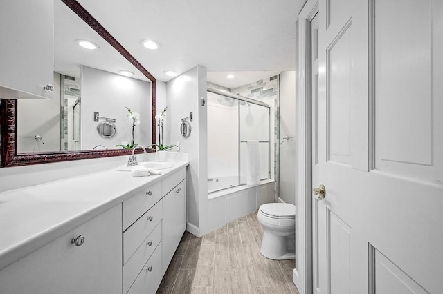 30 Eastern Point Dr Unit 30, Shrewsbury, MA 01545 - bathroom featuring toilet, vanity, recessed lighting, and wood finished floors
