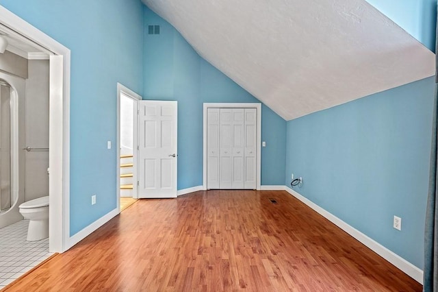 30 Eastern Point Dr Unit 30, Shrewsbury, MA 01545 - bonus room featuring wood finished floors, baseboards, arched walkways, and high vaulted ceiling