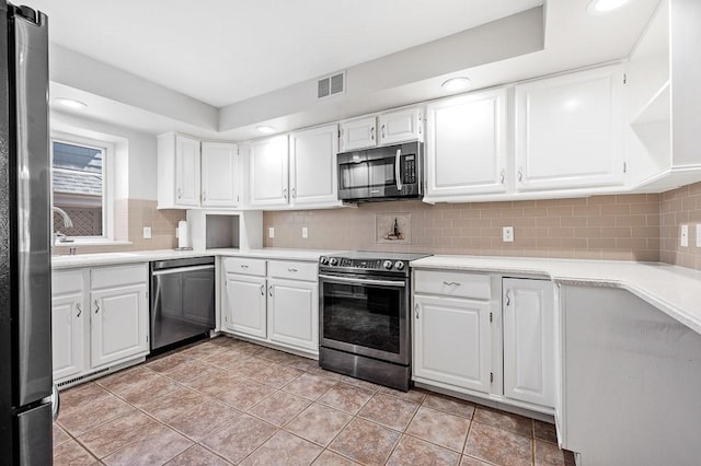 30 Eastern Point Dr Unit 30, Shrewsbury, MA 01545 - kitchen with stainless steel appliances, a sink, white cabinets, light countertops, and recessed lighting