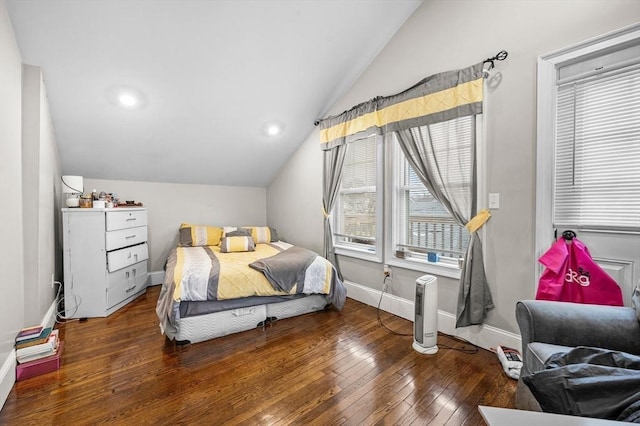 bedroom featuring dark wood-type flooring and lofted ceiling