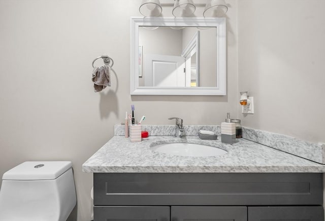 bathroom with vanity and toilet