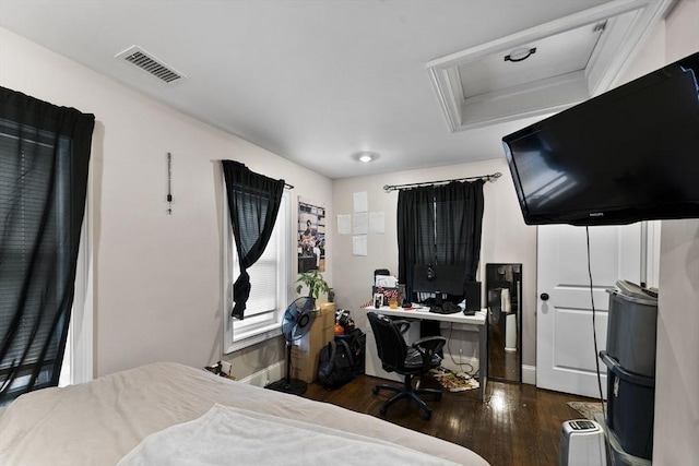 bedroom with dark hardwood / wood-style flooring