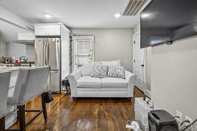 living room with dark hardwood / wood-style flooring