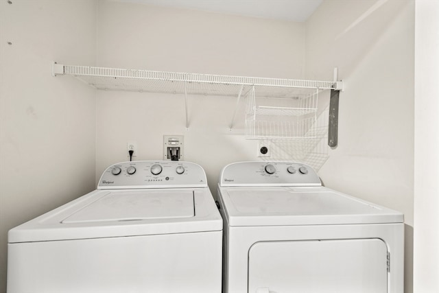 clothes washing area featuring independent washer and dryer