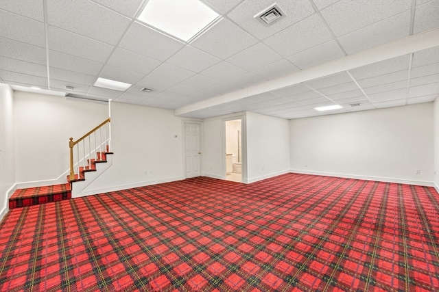 basement featuring a drop ceiling