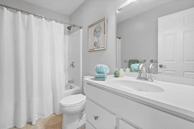 full bathroom featuring tile patterned floors, toilet, vanity, and shower / bath combo