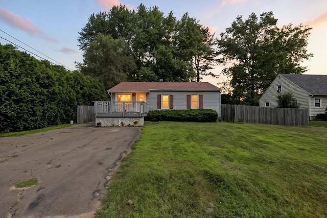 14 Carlton St, South Hadley, MA 01075 - view of front facade featuring a deck and asphalt driveway