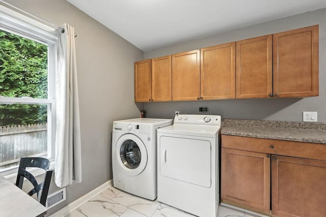 14 Carlton St, South Hadley, MA 01075 - laundry room with cabinet space, washing machine and dryer, and light marble finish flooring