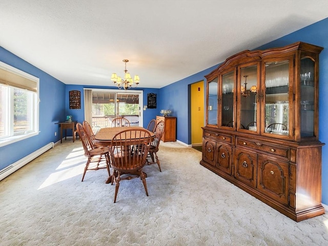 dining room with light carpet, a baseboard radiator, a chandelier, and baseboards