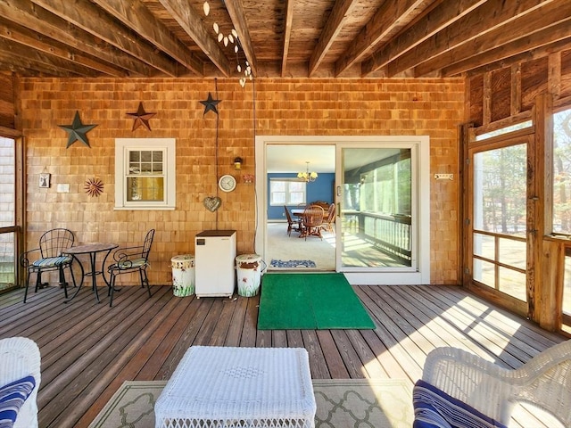 sunroom / solarium with beamed ceiling