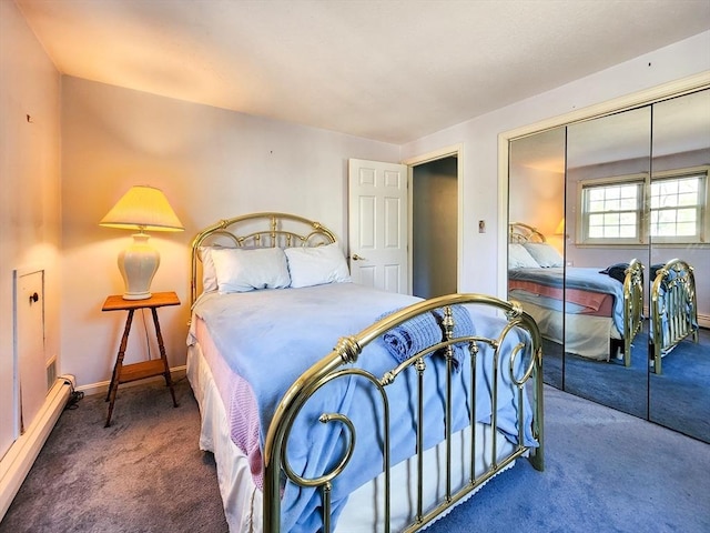 bedroom with carpet floors, a baseboard radiator, baseboards, and a closet