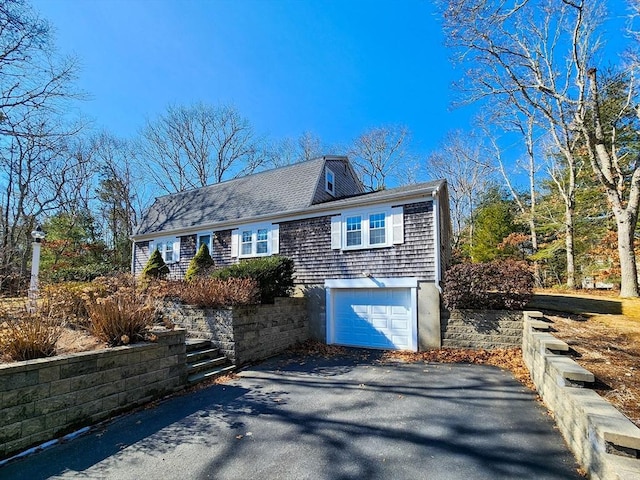 view of front of property with a garage and driveway