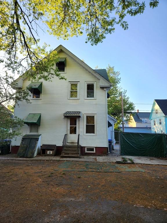 12 Payton St, Providence, RI 02905 - rear view of property with entry steps, a gate, and fence