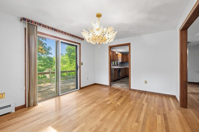 18 Bismark St, Dedham, MA 02026 - unfurnished dining area featuring a baseboard radiator, light wood-style floors, and a chandelier