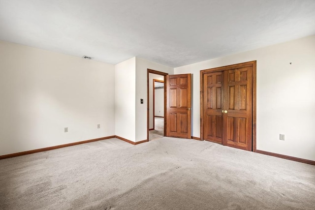 18 Bismark St, Dedham, MA 02026 - unfurnished bedroom featuring carpet flooring and a closet