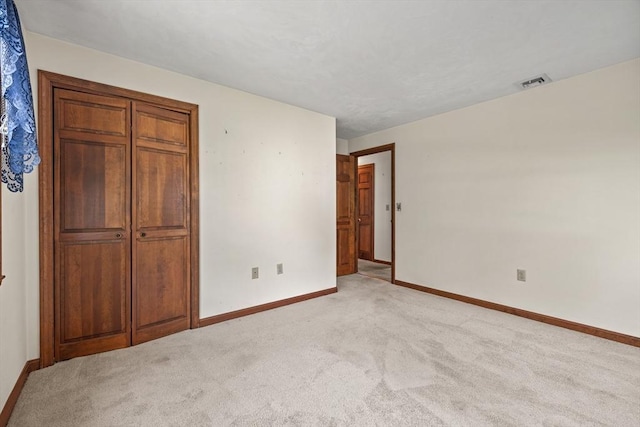 18 Bismark St, Dedham, MA 02026 - unfurnished bedroom with light colored carpet and baseboards