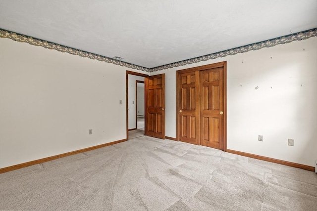18 Bismark St, Dedham, MA 02026 - empty room featuring light carpet