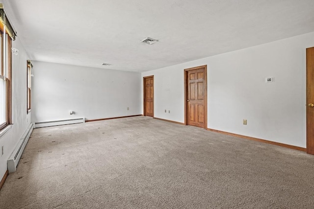 18 Bismark St, Dedham, MA 02026 - spare room featuring baseboard heating and light colored carpet