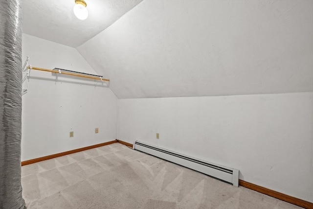 18 Bismark St, Dedham, MA 02026 - additional living space with baseboard heating, lofted ceiling, and carpet floors