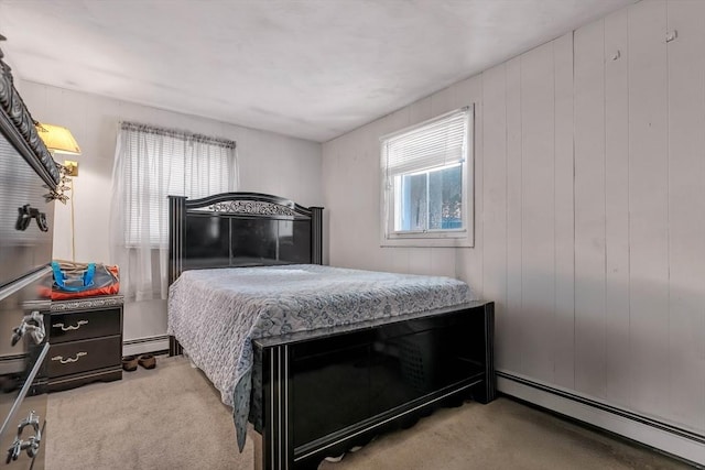 bedroom with a baseboard radiator and carpet