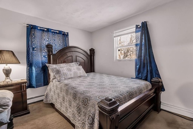 bedroom with carpet floors and baseboard heating