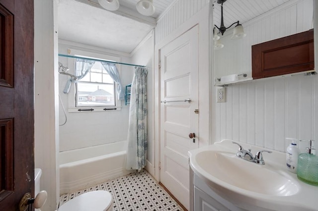 full bathroom featuring sink, toilet, ornamental molding, and shower / bathtub combination with curtain