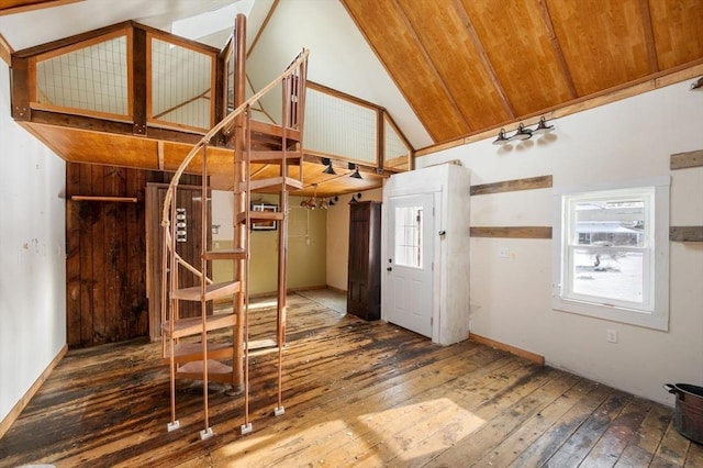 entryway with wood-type flooring, plenty of natural light, and high vaulted ceiling