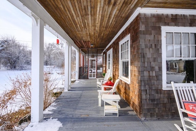 view of snow covered deck