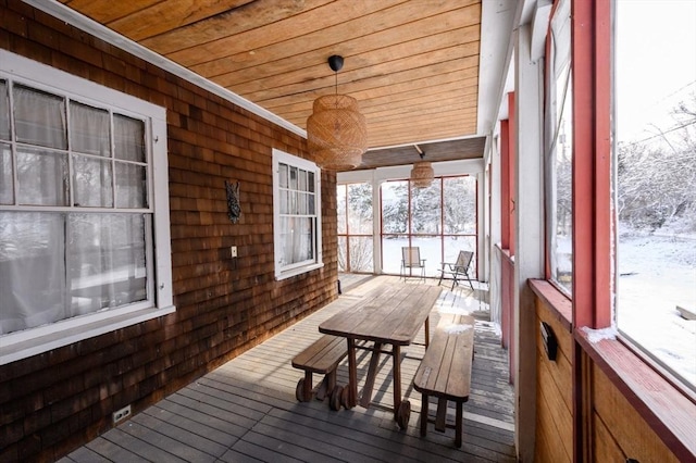 sunroom / solarium featuring wood ceiling