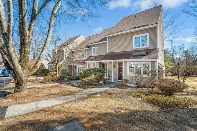 view of front of home with a shingled roof