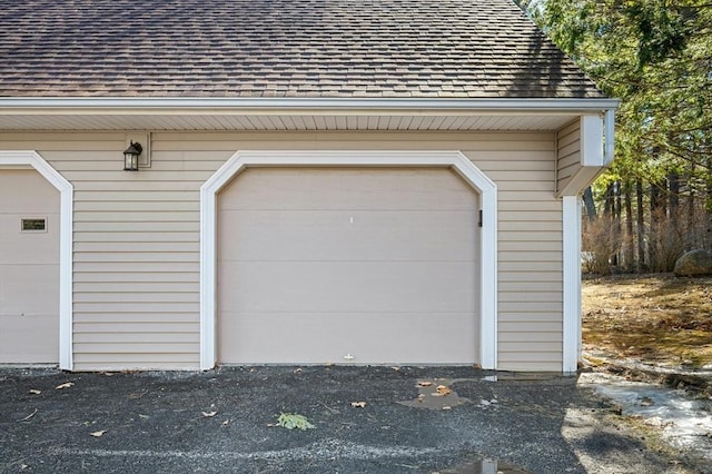 garage with aphalt driveway