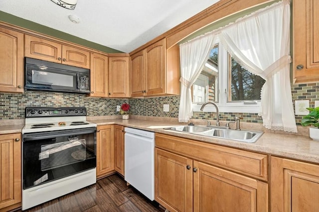 kitchen with electric stove, a sink, white dishwasher, light countertops, and black microwave