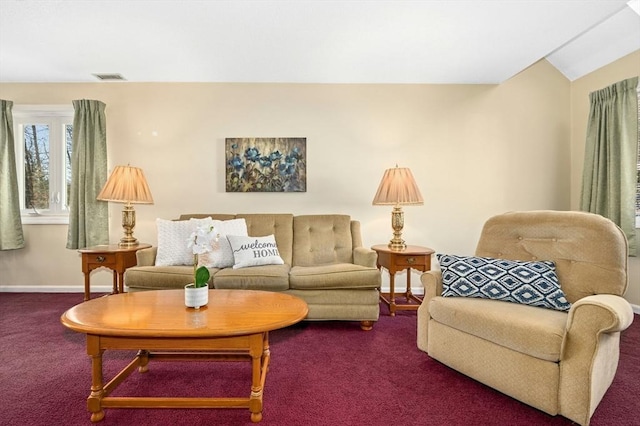 carpeted living room featuring baseboards and visible vents