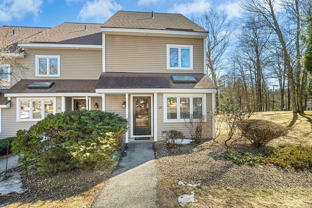 view of front of property featuring roof with shingles