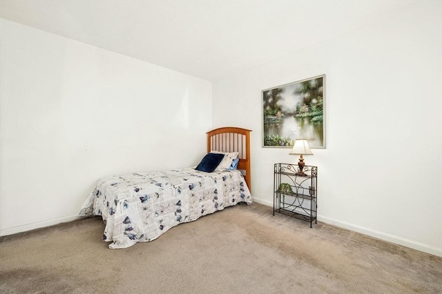 carpeted bedroom with baseboards