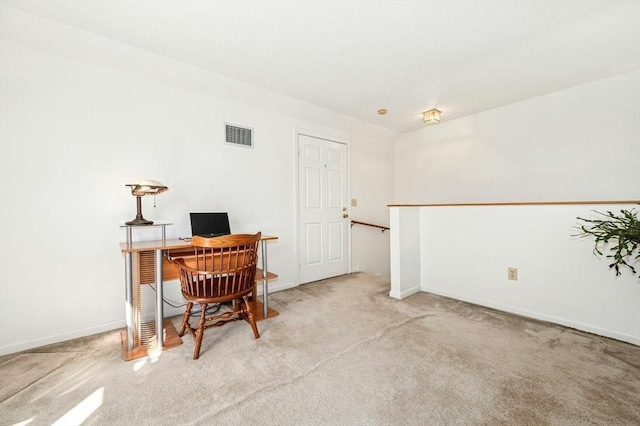 carpeted office with baseboards and visible vents