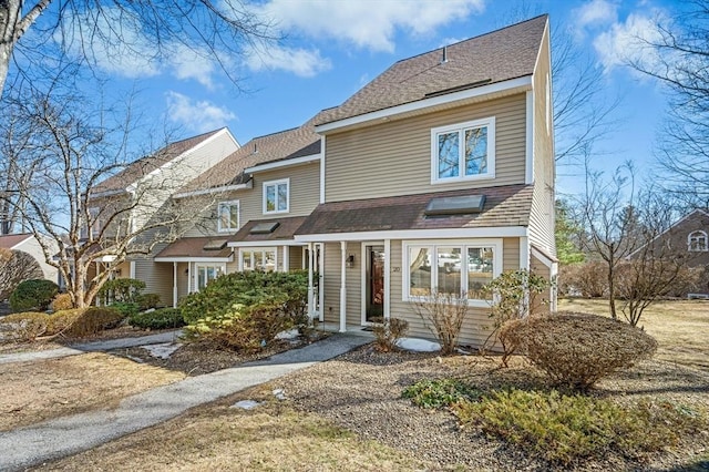 view of front of property featuring roof with shingles